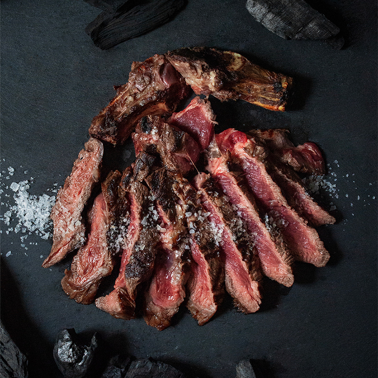 Dry-aged bife ancho, sliced over charcoal